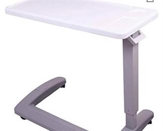 Nearly new rolling over-bed (or chair, sofa) table, metal frame, plastic top, adjustable height.