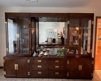 Vintage Henredon Scene One wall unit. Use as is or remove cross-bar and large mirror to separate into three individual multi-use pieces - two glass shelf Campaign One cabinets with interior lighting and a six-drawer Campaign One bureau or chest. Sold as a set or individually. Each cabinet measures 32" W x 18" D x 82" H. Chest measures 45" W x 18" D x 28" H. Photo 1 of 2.