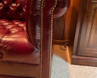 Hancock & Moore Chesterfield burgundy leather upholstered loveseat. Measures 65" W x 35" D. Photo 2 of 2.