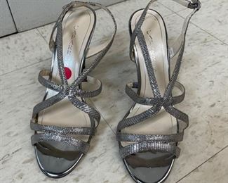 Brand new silver strappy Caparros heels. Size 9. Photo 1 of 2.