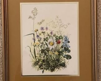 Framed watercolor and pen of flowers.