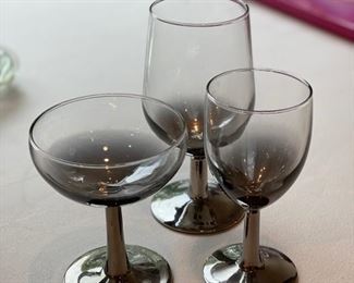 Assorted mid-century smokey glass stemware.