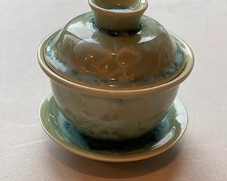 Chinese porcelain lidded tea cup and saucer. Photo 1 of 2.