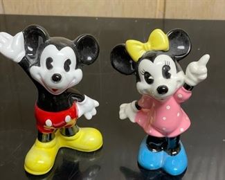 Miniature Minnie and Mickey Mouse figurines.