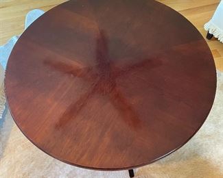 Top view of cocktail table (ceiling fan reflection seen)