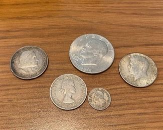 Columbus half dollar
Silver jfk
Eisenhower bicentennial dollar
Foreign coins 