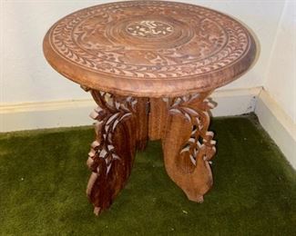 This piece looks bigger than it really is. I’m not sure why you would do with such a tiny little table. It could be a riser. We love risers in our business.