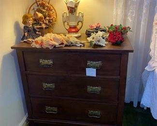 This antique three drawer chest will compliment any room.