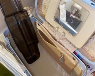 This vintage train case is in pristine condition! Super clean with the train and the mirror is adjustable.