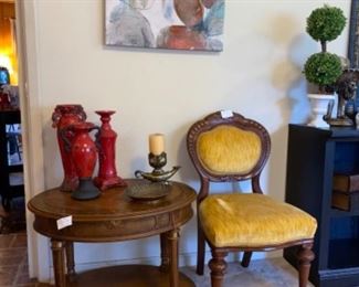 Y’all look at that gorgeous gold velvet chair! And here is the sister table to the round one I told you about