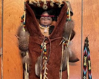 Native American doll in papoose 