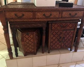 Woven desk, cabinet, accent table and storage/seat.