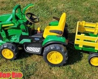 John Deere Peg Perego ride on tractor loader with trailer. Unit needs battery. Will work