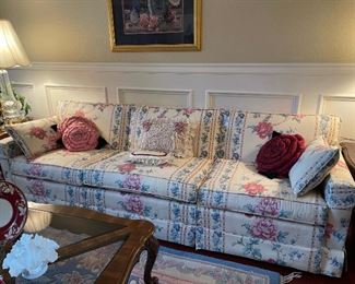 Vintage, beautiful upholstered sofa with two cushions