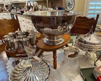 A close look at the Silver plate punch bowl with cups, Silver plate goblets, Silver plate serving pieces