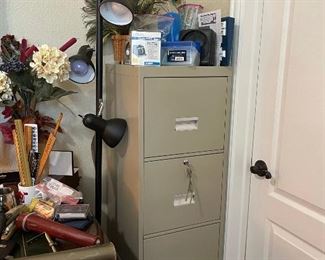 Metal filing cabinet, floor spot lamp