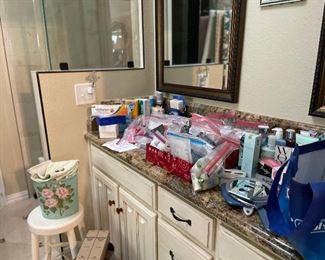 Master bathroom contains lots of lotions and potions