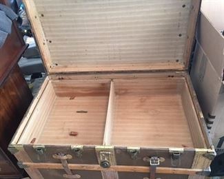 The first of two trays inside the trunk