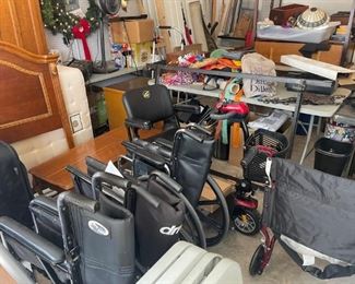 Three wheelchairs and another power wheelchair.