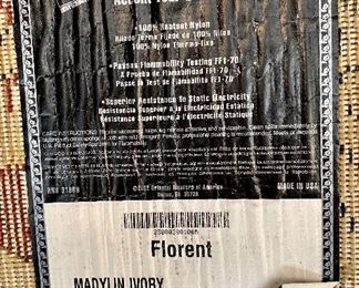 Synthetic area rug, made in USA, 7’10” by 11’2”.