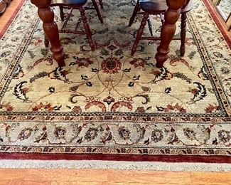 Synthetic area rug, made in USA, 7’10” by 11’2”.