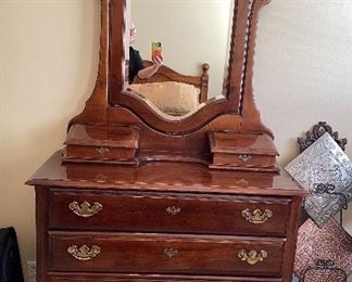 Antique-style dresser with mirror and glove boxes.