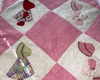 Several quilts—both vintage and newer, most hand stitched, varying condition.