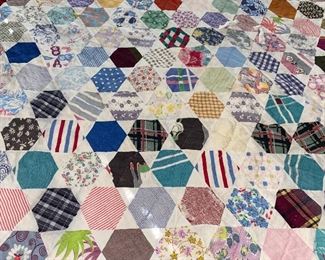 Several quilts—both vintage and newer, most hand stitched, varying condition.