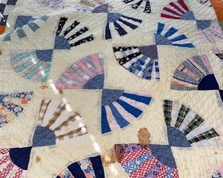 Several quilts—both vintage and newer, most hand stitched, varying condition.