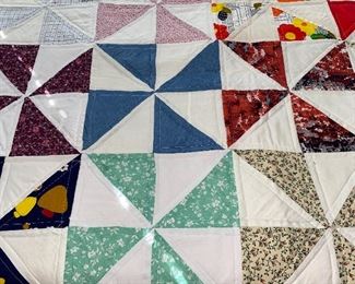 Several quilts—both vintage and newer, most hand stitched, varying condition.