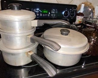Lots of kitchenware. Vintage Kitchen Craft aluminum cookware shown here.