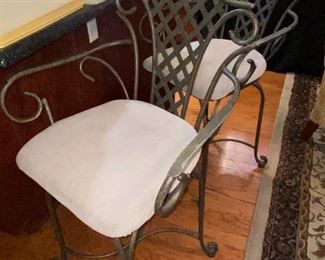 Pair wrought iron swivel bar stools.