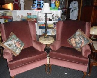 Pair of wing back chairs, Wrought iron and stone stand