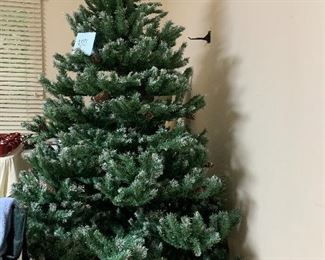 Beautiful 7’ Christmas Tree. We didn’t spread the limbs apart to make it easier to pack up for you.