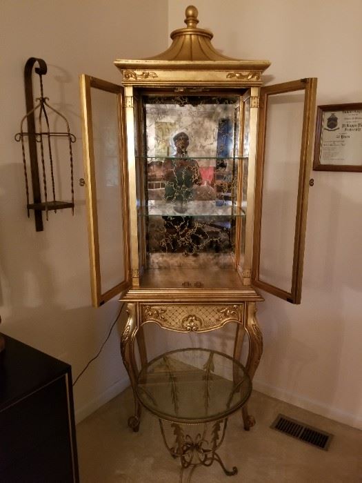Gold display case, metal glass top table, iron candle holder
