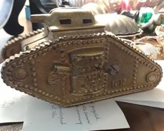 1918 still bank patterned afte WWI tank. Passed down in family. Write up about it on two cards. 