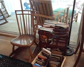 Child's rocking chair; Canterbury for magazines and books; basket filled with frames