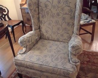 Traditionally styled, upholstered wing chairs with blue and white fabric, two of these