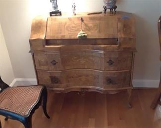 Beautiful inlaid desk with two drawers below and slant front top. 