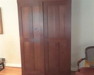 Fine cherry cupboard originating in Tennessee most likely, descended in family. Shelves behind paneled door in right and rod on left.