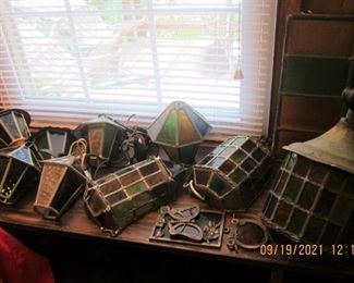 SOME OF THE GREAT STAINED GLASS LIGHT FIXTURES WHICH WERE RETURNED FROM EUROPE.