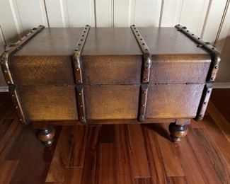 Vintage Wooden Steamer Trunk on Jacobean Legs    1920s-1930s Steamer Trunk with Brass Hardware and Oversized Nailhead Trim.  Leather Straps on Front, Sides, and Top of Trunk.  All in Nearly Mint Condition. 
See pictures for details and condition.