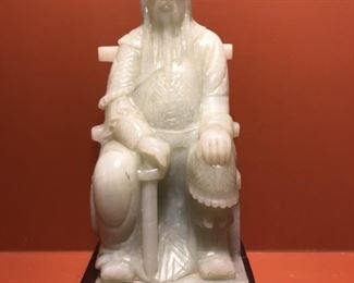 Chinese Carved White Jade Statue on Stand
Sits on a carved rosewood stand
11.5in t x 5in w at base
 Approximately 8 lbs