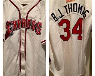 Signed / Autographed By Nolan Ryan, BJ  Thomas
Jersey presents to him and work we he threw out the first pitch at the Round Rock Express Game!