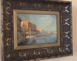 Oil Painting of the Doges Palace by Bouvard - Antoine Bouvard was a French landscape artist who notably often painted under the pseudonym Marc Aldine. Bouvard remains best known for his renderings of Venetian canal scenes, painted in warm tones and a hazy light that often accompanies the setting of the sun. A typical work is A Gondolier Before a Venetian Bridge, depicting the grand canal of the famous Italian city in a realist style that remained popular with tourists throughout his career. He was notably influenced by the French painter Félix Ziem, who was also popular for his poetic depictions of maritime scenes and port cities. Bouvard was born in 1870 in St. Jean-de-Bournay in L'Isere, France, and went on to study at the Academy of Beaux-Arts in Paris, befriending the French architect Constant-Dufeux who helped shape his career and aesthetic. He eventually became the director of architectural services for the Seine in tandem with his painting career, and is accredited with the cons