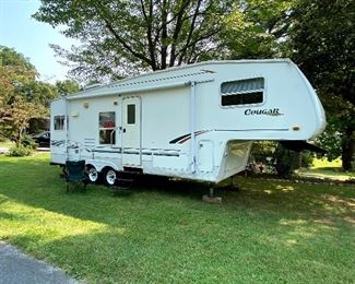 2000 Cougar 5th Wheel Camper by Keystone 8700 lbs 
27’ 6”, 30 amp, Sleeps six, built in sound, electric / propane fridge, propane stove / oven, propane heat, microwave, queen bed with new mattress.  
A/C needs attention - turns on but no air
Damage on right front
Broken plexiglass window