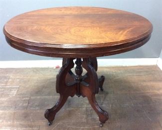 ANTIQUE OVAL TABLE ON WHEELS