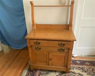 Turn of the century oak wash stand altered to have towel bar $300.00