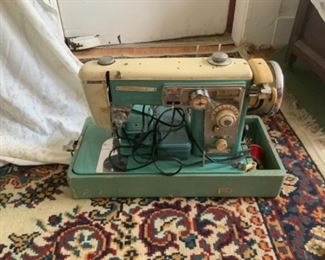 Vintage turquoise wizard sewing machine in travel box 175.00