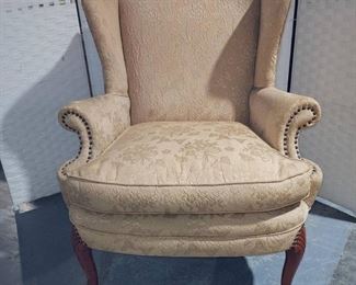 Lovely Peach Colored Wingback Chair with Nail Head Trim